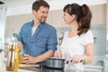 happy couple cooking in kitchen Royalty Free Stock Photo