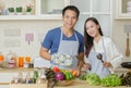 Happy couple cooking together,Man and woman in the kitchen Royalty Free Stock Photo