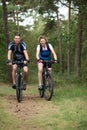 Happy couple cycling in nature Royalty Free Stock Photo