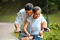 Happy couple cycling in the summer park Royalty Free Stock Photo