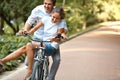 Happy Couple Cycling in the Summer Park Royalty Free Stock Photo