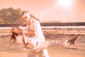 Happy couple dancing on the beach together