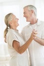 Happy Couple Dancing At Home Royalty Free Stock Photo