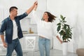 Happy couple dancing in kitchen Royalty Free Stock Photo