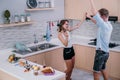 Happy couple dancing together when prepare cooking