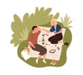 Happy couple on date outdoors. Man and woman spending summertime together resting on picnic blanket in nature. Young