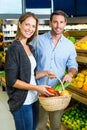 Happy couple doing grocery shopping Royalty Free Stock Photo