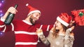 Happy couple drinking champagne at christmas time - Young people having fun celebrating xmas holidays Royalty Free Stock Photo