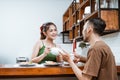 happy couple drinking coffee at dinner together in kitchen Royalty Free Stock Photo