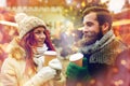 Happy couple drinking coffee on old town street Royalty Free Stock Photo