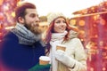 Happy couple drinking coffee on old town street Royalty Free Stock Photo