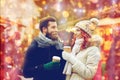 Happy couple drinking coffee on old town street Royalty Free Stock Photo