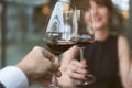 Happy couple drinking red wine. Focus on wine glass Royalty Free Stock Photo