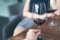 Happy couple drinking red wine. Selective focus on wine glass Royalty Free Stock Photo