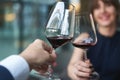 Happy couple drinking red wine. Selective focus on wine glass Royalty Free Stock Photo