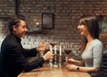 Cheerful couple drinking wine and having romantic dinner at home. Home date night, Royalty Free Stock Photo