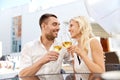 Happy couple drinking wine at open-air restaurant Royalty Free Stock Photo