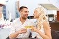 Happy couple drinking wine at open-air restaurant Royalty Free Stock Photo