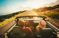 Happy Couple Driving in Convertible Royalty Free Stock Photo