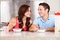 Happy couple eating cereal Royalty Free Stock Photo