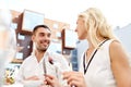 Happy couple eating dinner at restaurant terrace Royalty Free Stock Photo