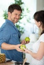 happy couple eating fresh fruits having fun Royalty Free Stock Photo