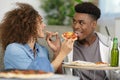 happy couple eating pizza at home Royalty Free Stock Photo