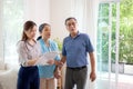 Happy couple elderly looking new home while agent real estate explaining and visit. Royalty Free Stock Photo