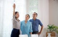 Happy couple elderly looking new home while agent real estate explaining and visit.