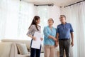 Happy couple elderly looking new home while agent real estate explaining and visit, realtor talking customer about rental housing Royalty Free Stock Photo