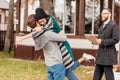 Happy couple embracing after buying new own house, celebrating relocation Royalty Free Stock Photo