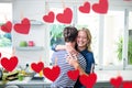 Happy couple embracing each other in kitchen Royalty Free Stock Photo