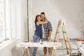 Happy couple embracing in home under construction Royalty Free Stock Photo