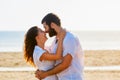 Happy couple embracing on sea beach Royalty Free Stock Photo