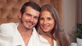 Happy couple embracing smiling to the camera together Royalty Free Stock Photo