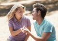 Happy couple, engagement and ring in nature for love, support or commitment in forest or outdoor romance. Young man and