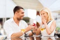 Happy couple with engagement ring and wine at cafe Royalty Free Stock Photo