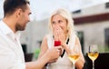 Happy couple with engagement ring and wine at cafe Royalty Free Stock Photo