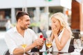 Happy couple with engagement ring and wine at cafe Royalty Free Stock Photo