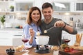 Happy couple enjoying fondue dinner