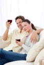 Happy couple enjoying their glasses of red wine Royalty Free Stock Photo