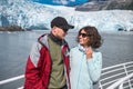 Happy Couple Enjoys Her Boat Tour To The Glacier In Alaska, USA.