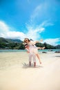 Happy couple enjoys life on a tropical paradise island Royalty Free Stock Photo