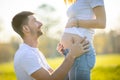 Happy couple expecting baby, pregnant woman with husband, young family and new life concept Royalty Free Stock Photo