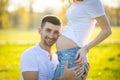 Happy couple expecting baby, pregnant woman with husband, young family and new life concept Royalty Free Stock Photo