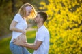 Happy couple expecting baby, pregnant woman with husband, young family and new life concept Royalty Free Stock Photo