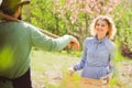 Happy Couple Farmers working with spud on spring field. Young Couple gardening in the garden. Cheerful couple of farmers