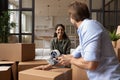 Happy couple feel excited packing boxes on moving day Royalty Free Stock Photo