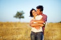 Happy couple in a field Royalty Free Stock Photo