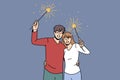 Happy couple with fireworks celebrate New Year Royalty Free Stock Photo